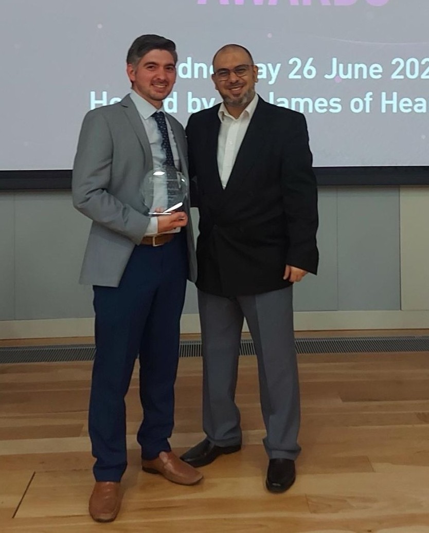 Professor Iain Rice receiving an award